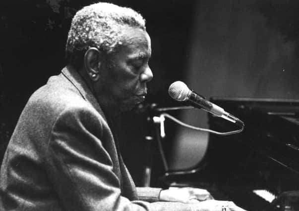 Champion Jack Dupree takes his first look at St George's Hall in Bradford, in 1990.