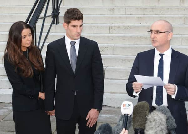 Footballer Ched Evans and partner Natasha Massey with solicitor Shaun Draycott (right) outside Cardiff Crown Court, where Evans has been found not guilty of raping a teenager in a hotel in north Wales following a two week retrial. PRESS ASSOCIATION Photo. Picture date: Friday October 14, 2016. See PA story COURTS Evans. Photo credit should read: Ben Birchall/PA Wire