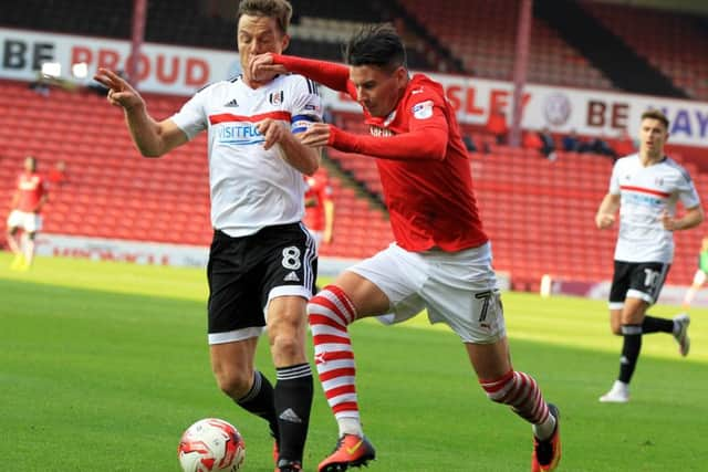 UP AGAINST IT: Adam Hammill battles against Scott Parker. Picture: Chris Etchells