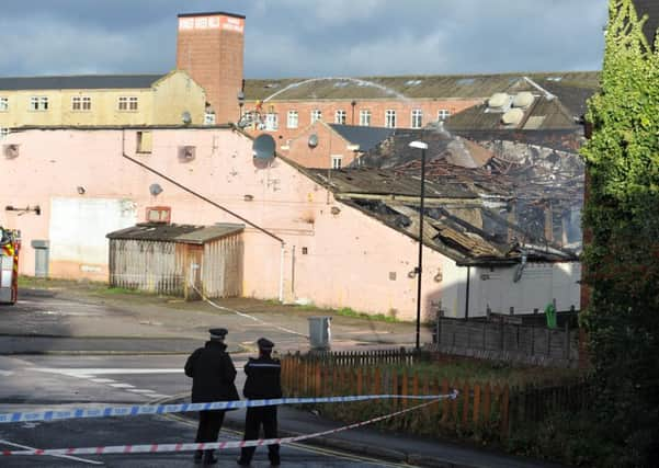 Firefighters dampen down blaze at the New Western Bingo Hall and Sauna in Armley. Picture: Tony Johnson