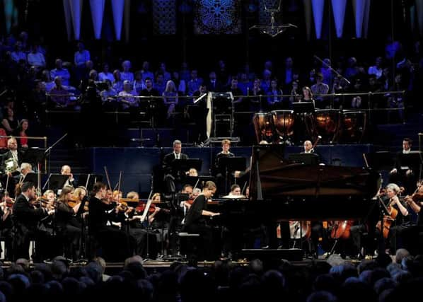 Picture by Simon Wilkinson/SWpix.com - 12/09/2015 - Leeds International Piano Competition Final - Leeds Town Hall, Leeds, England - Anna Tcybuleva wins first prize in the Leeds International Piano Competition 2015. Sir Mark Elder

copyright picture - Simon Wilkinson - simon@swpix.com