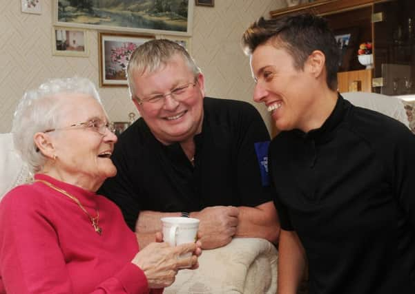 Guiseppina Maria Price with PCSO Mick Cox and Sgt Louise Julian.