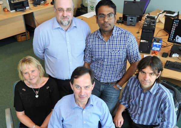 Nick Kitchin, founder and CEO of Cumulus (centre) and the Cumulus Energy Storage team. Credit Roger Moody.