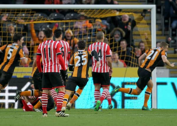 Hull Citys Michael Dawson, right, runs away to celebrate after scoring what proved the winning goal in their 2-1 defeat of Southampton. Hull had trailed to an early penalty from Charlie Austin (Picture: Richard Sellers/PA Wire).