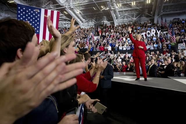 Hillary Clinton waves after speaking at a midnight rally in Raleigh, N.C.