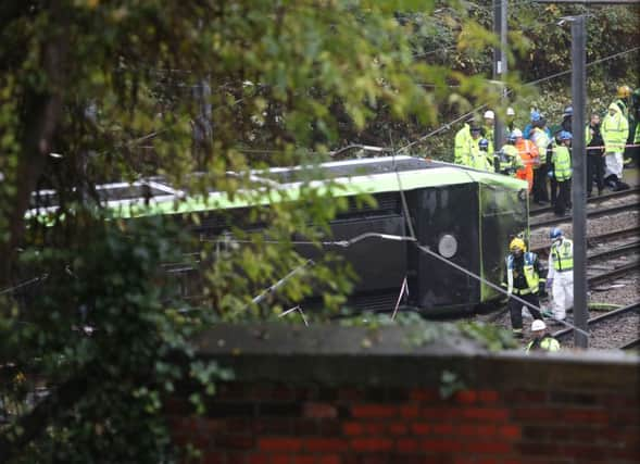 The scene after a tram overturned in Croydon, south London, trapping five people and injuring another 40.