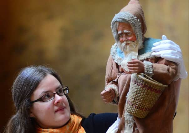 Curator Eleanor Matthews with a plaster figurine of Santa which has been discovered at Brodsworth Hall. Picture Scott Merrylees