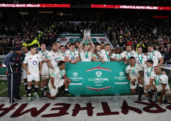 England players celebrate with the Autumn International trophy during the Autumn International match at Twickenham Stadium, London. (Pic: PA)