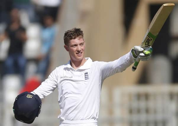 England's batsman Keaton Jennings raises his bat after scoring century on the first day of the fourth cricket test match between India and England in Mumbai, India, Thursday, Dec. 8, 2016. (AP Photo/Rafiq Maqbool)