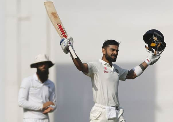 Indian cricket captain Virat Kohli celebrates after reaching his century (AP Photo/Rafiq Maqbool)