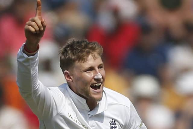 Chief wicket-taker: Joe Root celebrates one of his two wickets (AP Photo/Rafiq Maqbool)