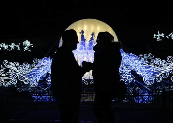 Stefan Hibbitt, from Alwoodley, went down on one knee to propose to his girlfriend of eight years Amy Brown, 22, in front of the romantic Love Bridge at the Magical Lantern Festival Yorkshire in Roundhay Park, Leeds. Image: Pat Bannon