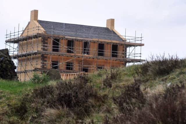 The replica parsonage during construction earlier this year. (YPN).