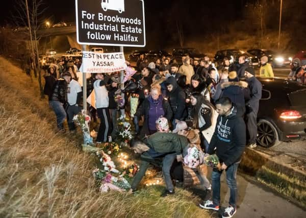 Mourning friends and family hold a vigil at Jct 24 of the M62 near Huddersfield, West Yorks., where yesterday (03/01) police shot and killed Yassar Yaqub, 28, during a pre-planned operation, January 04 2017.