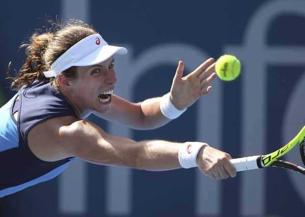 Britain's Johanna Konta reaches to play a shot to Australia's Daria Gavrilova during their women's singles match at the Sydney International tennis tournament in Sydney, Australia. (AP Photo/Rick Rycroft)