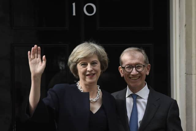 Theresa May with her husband Philip outside 10 Downing Street after she became Prime Minister.