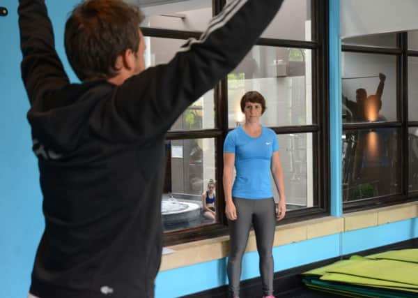 Rachael Tibbs directs European Tour professional Chris Hanson through a fitness session at Oulton Hall, Leeds.