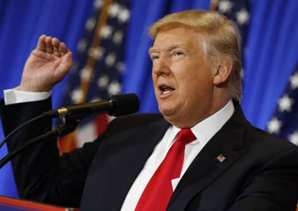 President-elect Donald Trump speaks during a news conference in the lobby of Trump Tower in New York, Wednesday, Jan. 11, 2017. (AP Photo/Evan Vucci)