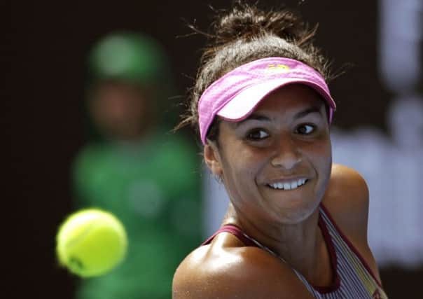 Britain's Heather Watson makes a backhand return to Australia's Samantha Stosur