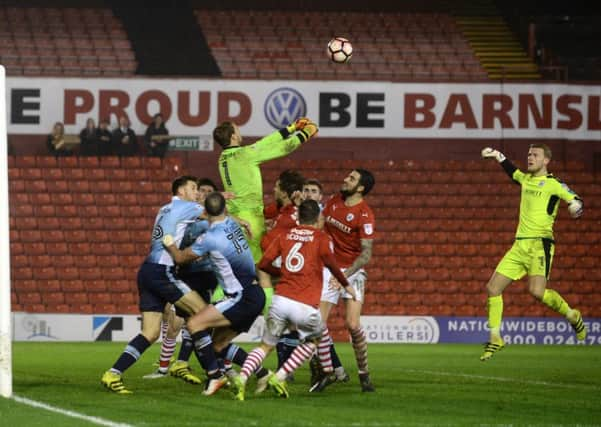 Blackpool's Sam Slocombe punches the ball clear in extra time. Picture Bruce Rollinson