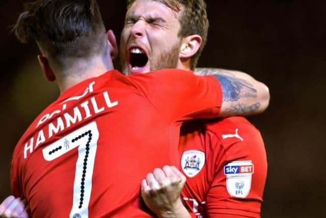 Sam Winnall with his former Barnsley team-mate Adam Hammill.