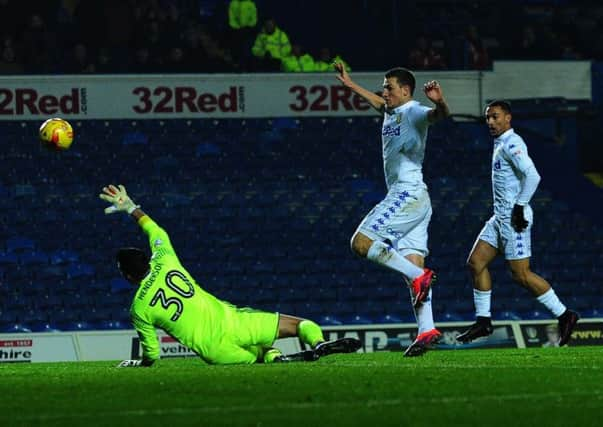 Close call: United's Chris Wood lifts the ball over Forest's Stephen Henderson but his goal is ruled offside.  Picture : Jonathan Gawthorpe