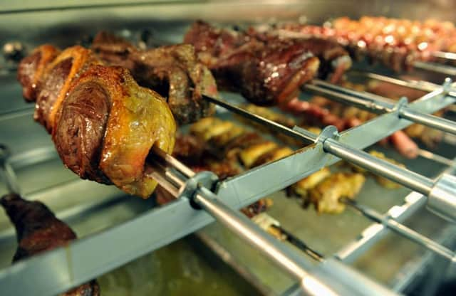 Meat on the giant grill at Vaqueiros in York.