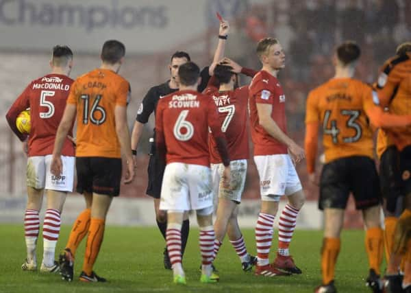 Alex Mowatt is sent off by referee Christopher Kavanagh in his first game playing for Barnsley.
 (Picture: Bruce Rollinson)