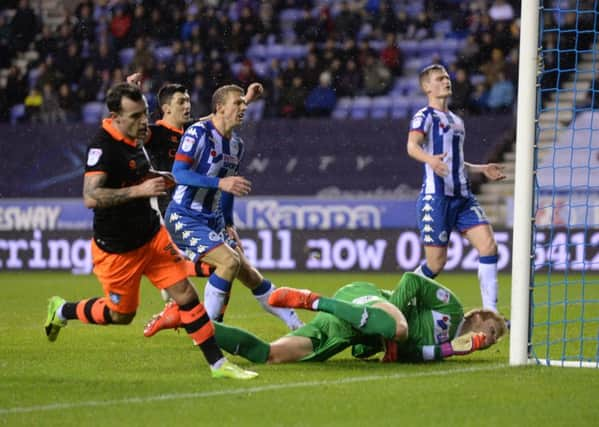 Ross Wallace turns away after scoring the only goal of the game to give Sheffield Wednesday victory over their Championship hosts Wigan Athletic (Picture: Bruce Rollinson).