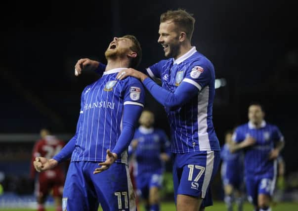 Owls' Sam Winnall celebrates his goal with Jordan Rhodes