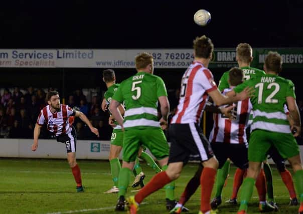 Lincoln Citys Luke Waterfall scores the only goal of the game to defeat North Ferriby United (Picture: Anna Gowthorpe/PA).