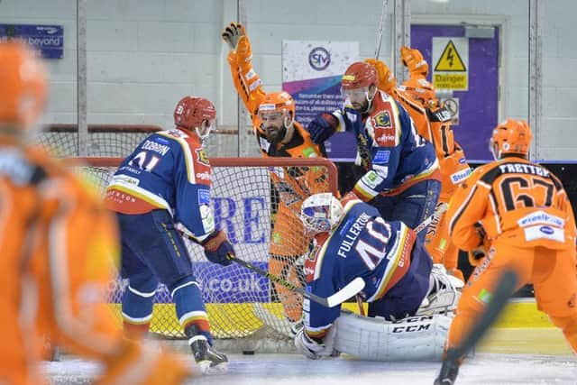 Mathieu Roy celebrates Markus Milsson's second of the night against Edinburgh. Picture: Dean Woolley.