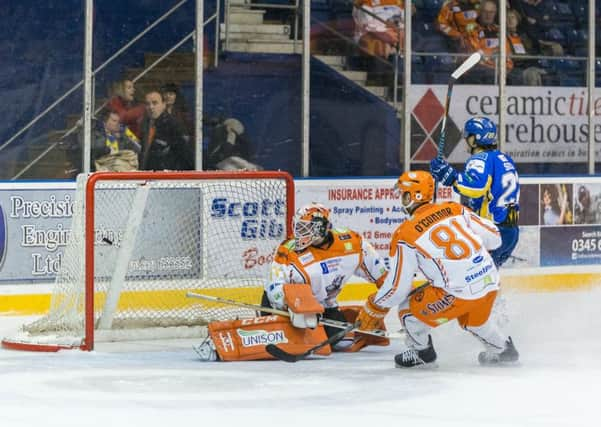 Sheffield Steelers Ben OConnor (No 81) cant prevent Fifes Mathew Sisca from firing past Ervins Mustukovs on Sunday night. Picture: EIHL/Martin Watterston