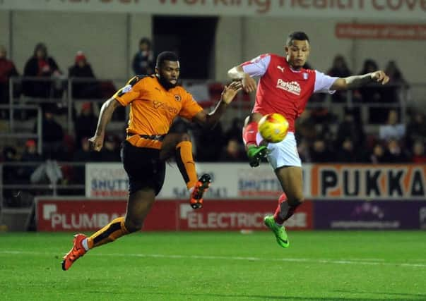 Unfamiliar sight: Rotherham United  striker Jonson Clarke-Harris being challenged by Ethan Ebanks-Landell. (Picture: Simon Hulme)