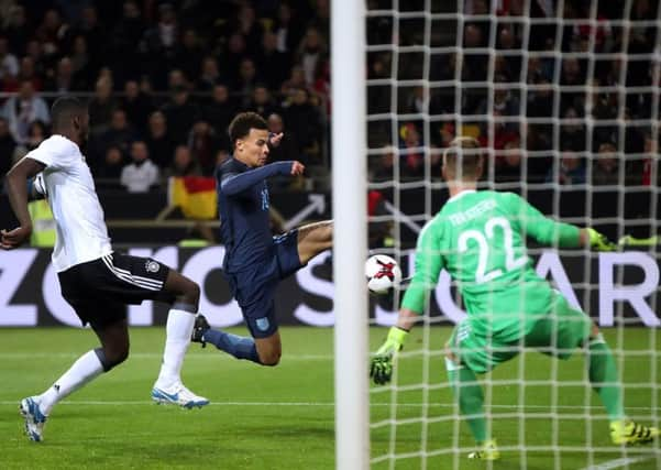 England's Dele Alli misses a chance at goal.