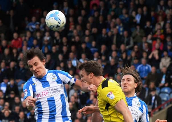 FLASHPOINT: Dean Whiteheads aerial challenge on Ben Turner led to the Town captains second yellow card in the 88th minute.  Picture: Bruce Rollinson