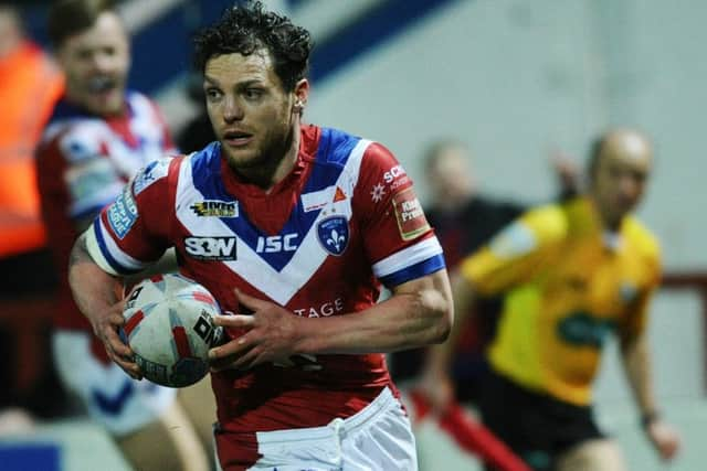 Wakefield's Scott Grix goes over for their second try.
 Picture: Jonathan Gawthorpe