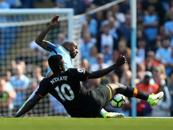 Manchester City's Fabian Delph (left) and Hull City's Alfred N'Diaye battle for the ball (Photo: PA)