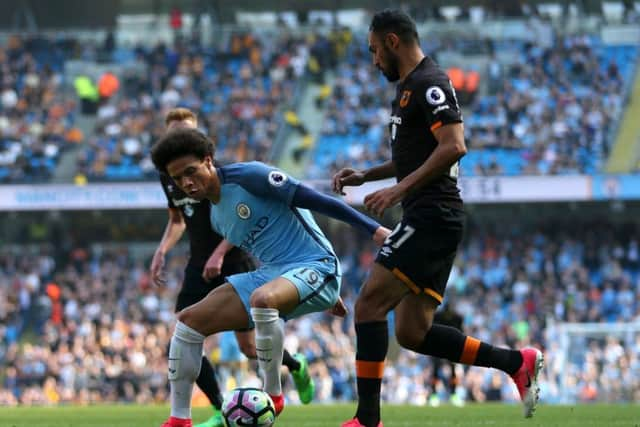 Manchester City's Leroy Sane (left) and Hull City's Ahmed Elmohamady. PIC: Dave Thompson/PA Wire