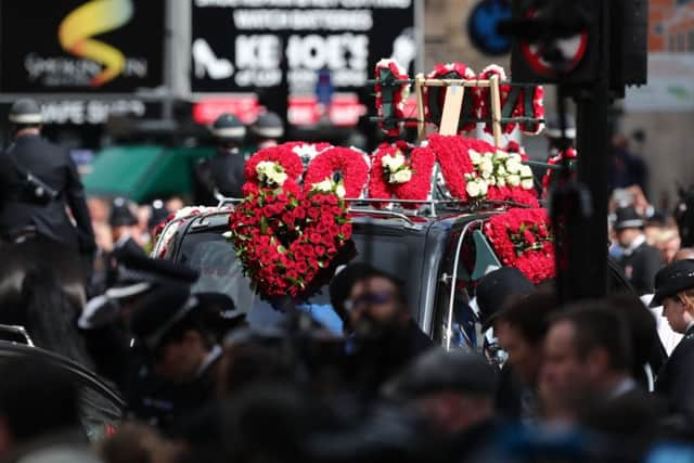 The coffin of Pc Keith Palmer makes its way to Southwark Cathedral in London after leaving Westminster's Chapel of St Mary Undercroft.