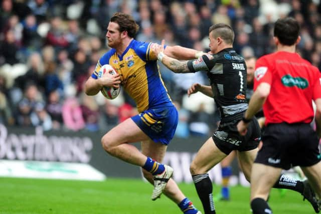 Hull FC v Leeds Rhinos' Anthon Mullally shrugs off  Hull FC's Jamie Shaul to score a try
 Picture: Tony Johnson.