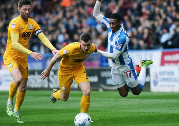 HIGH POINT: Huddersfield's Rajiv Van La Parra is fouled by Preston's Marnick Vermijl.
 Picture Jonathan Gawthorpe