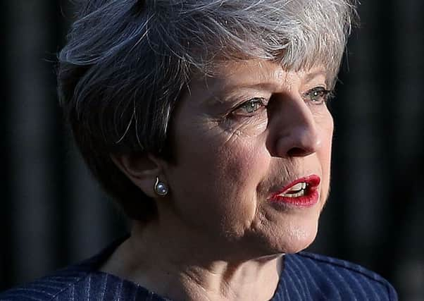 Theresa May on the steps of 10 Downing Street.