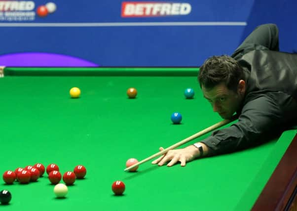 Ronnie O'Sullivan in action against Ding Junhui.