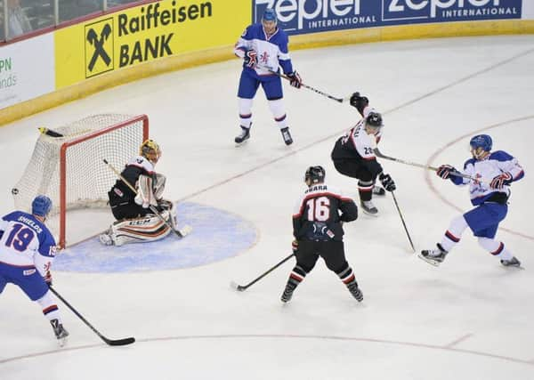 OPENING SALVO: Robert Dowd fires in GB's first period opener in Belfast. Picture: Dean Woolley.