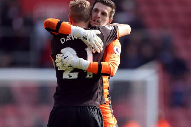 Hull City goalkeeper Eldin Jakupovic and Michael Dawson after the Premier League match at St Mary's, Southampton.