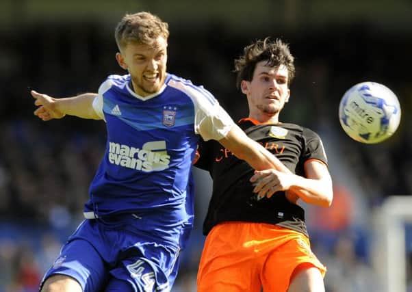 Ipswich's Emyr Huws battles Wednesday goalscorer Kieran Lee. (Picture: Steve Ellis)