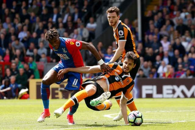 Crystal Palace's Wilfried Zaha (left) and Hull City's Andrea Ranocchia battle for the ball during the Premier League match at Selhurst Park, London. (Picture: Paul Harding/PA Wire)