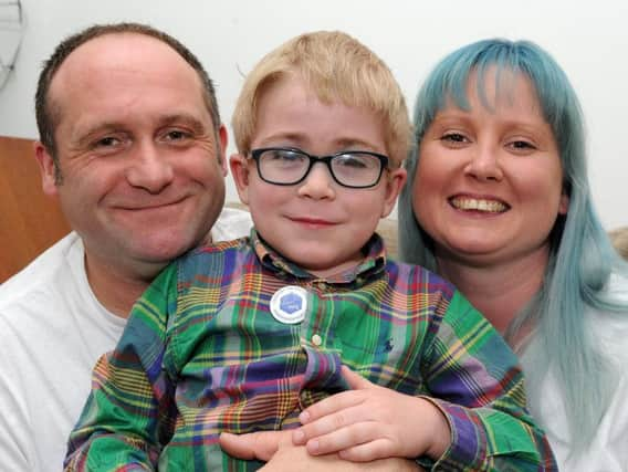 Little Harley Bond aged four with dad Wayne and mum Emma