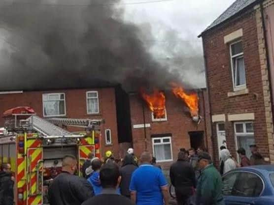 A crowd gathers outside the blaze in Page Hall.